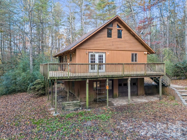 rear view of house with a wooden deck