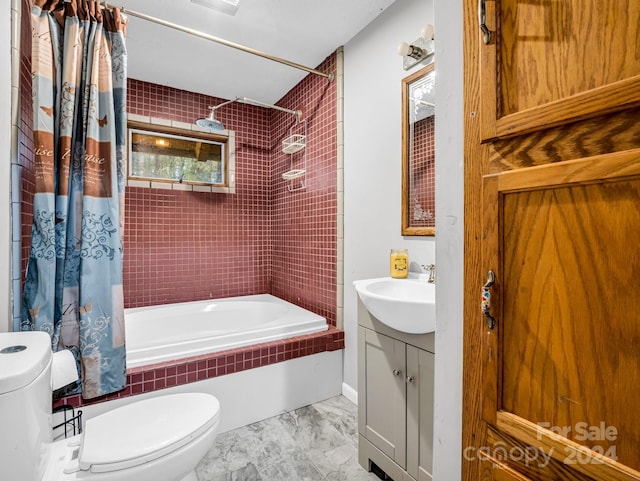 full bathroom with vanity, shower / tub combo with curtain, and toilet