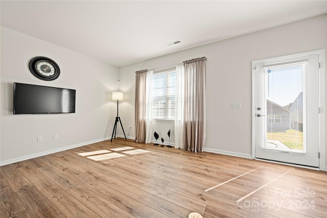 unfurnished living room featuring wood-type flooring