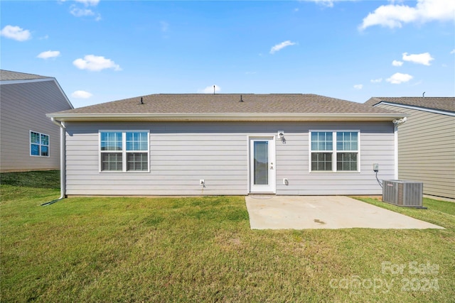 back of property with a patio area, a lawn, and central AC unit