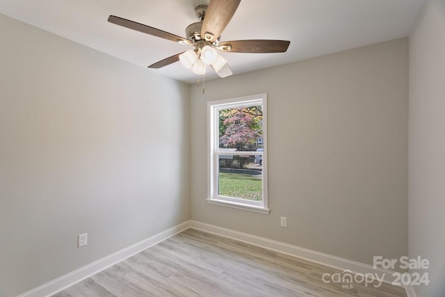 unfurnished room featuring light hardwood / wood-style flooring and ceiling fan