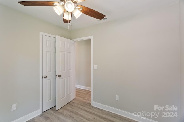 unfurnished bedroom featuring ceiling fan and light hardwood / wood-style flooring