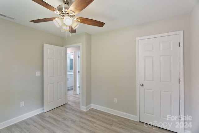 545 Shamel Ct, Winston Salem, NC 27105 - unfurnished bedroom featuring baseboards, light wood-type flooring, and a ceiling fan