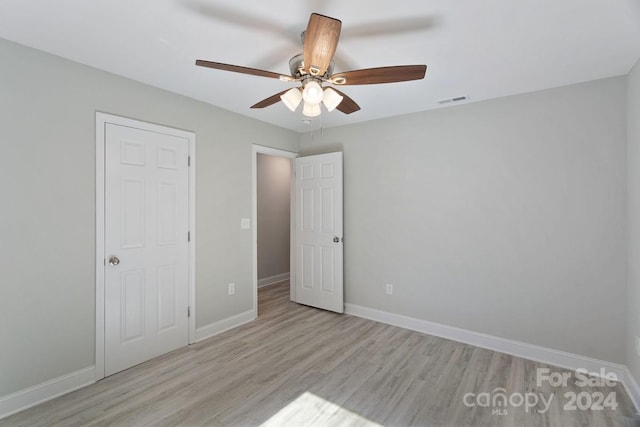 unfurnished bedroom featuring ceiling fan and light hardwood / wood-style flooring