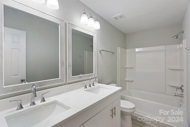 full bathroom featuring vanity, tub / shower combination, wood-type flooring, and toilet