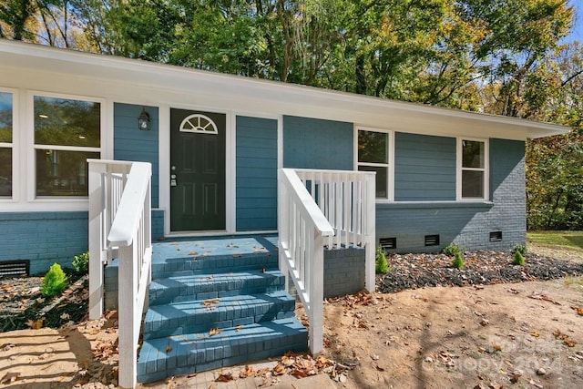 545 Shamel Ct, Winston Salem, NC 27105 - property entrance with crawl space, brick siding, and covered porch