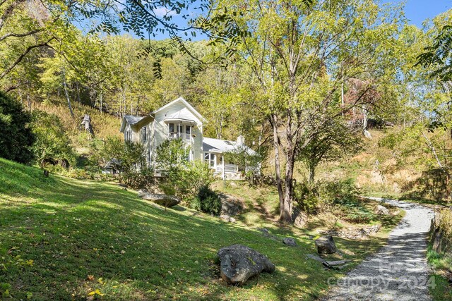 3942 Anderson Branch Rd, Marshall, NC 28753 - view of front of property with a front yard and a view of trees