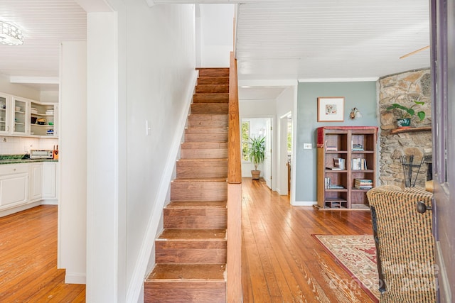 3942 Anderson Branch Rd, Marshall, NC 28753 - staircase featuring hardwood / wood-style flooring, ornamental molding, and baseboards