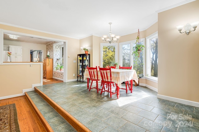 3942 Anderson Branch Rd, Marshall, NC 28753 - dining area featuring baseboards, a chandelier, ornamental molding, and stone finish floors