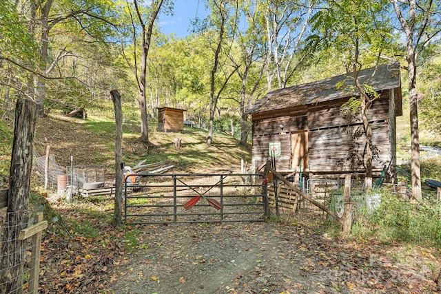 3942 Anderson Branch Rd, Marshall, NC 28753 - view of yard with a gate, fence, an outbuilding, and a barn