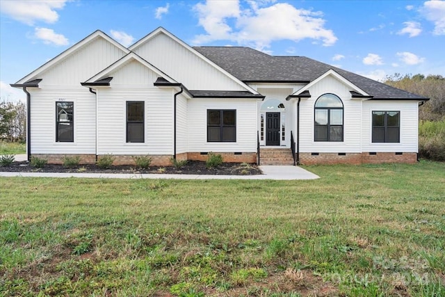 modern farmhouse style home with a front lawn