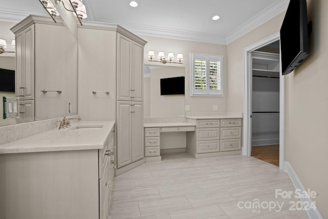 bathroom with vanity and ornamental molding