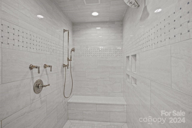 bathroom with a tile shower