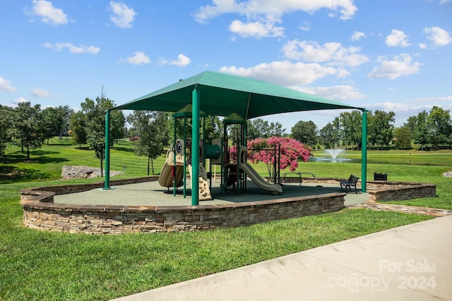 view of jungle gym with a lawn