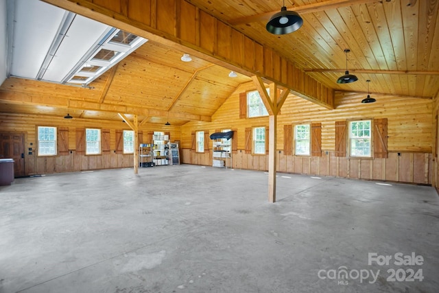 garage featuring wooden ceiling and wooden walls