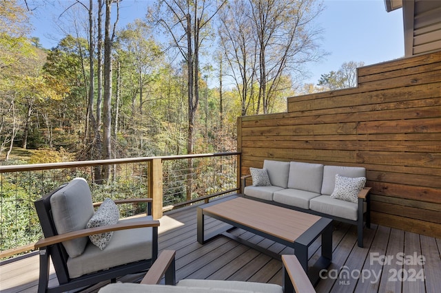 deck featuring outdoor lounge area