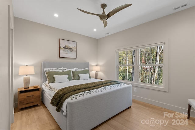 bedroom featuring light hardwood / wood-style floors and ceiling fan