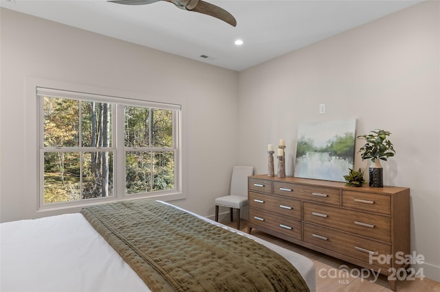 bedroom featuring hardwood / wood-style floors and ceiling fan