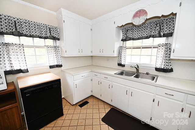 kitchen with dishwasher, white cabinets, sink, and a wealth of natural light