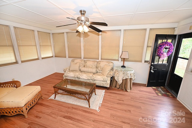 living room featuring ceiling fan and light wood-type flooring