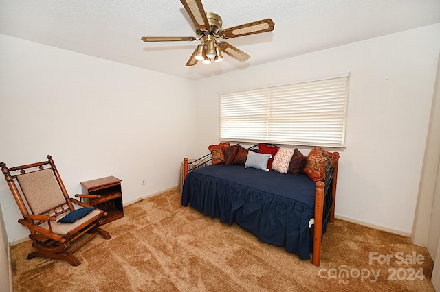 bedroom with light colored carpet and ceiling fan