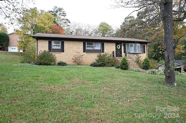 ranch-style house with a front yard