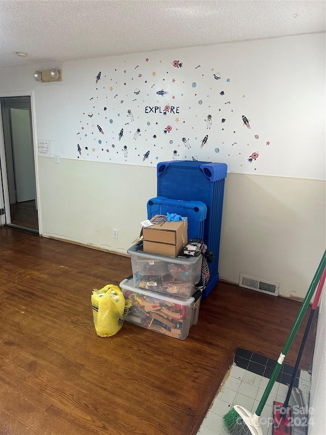 3238 Campbell Dr, Charlotte, NC 28205 - empty room with wood finished floors and a textured ceiling