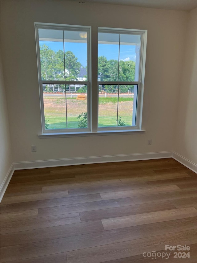 empty room featuring hardwood / wood-style flooring