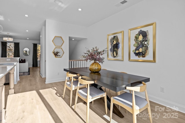 dining area with light hardwood / wood-style flooring