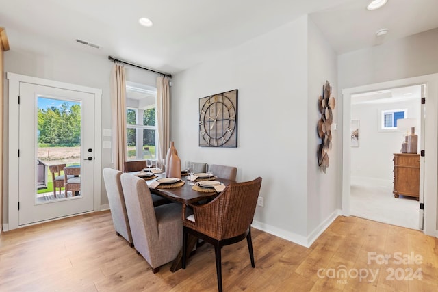 dining area with light hardwood / wood-style floors