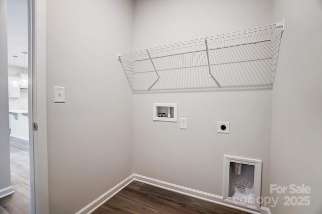 clothes washing area with washer hookup, dark wood-style flooring, electric dryer hookup, laundry area, and baseboards