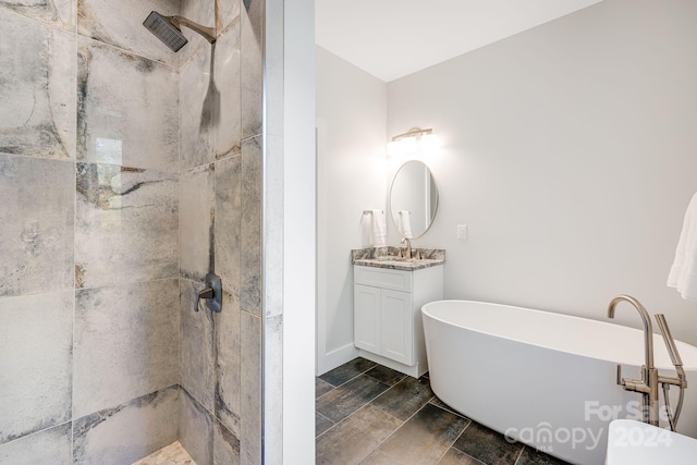 bathroom with vanity and separate shower and tub