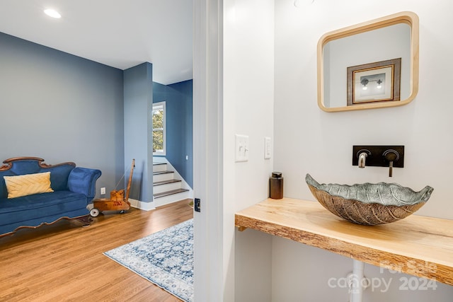 interior space with hardwood / wood-style flooring and sink