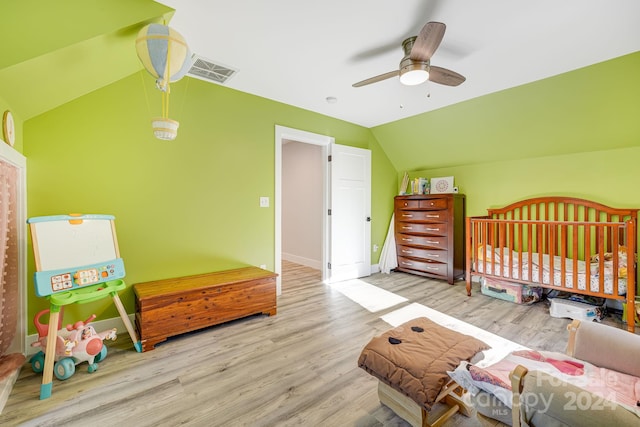 bedroom featuring vaulted ceiling, light hardwood / wood-style flooring, and ceiling fan