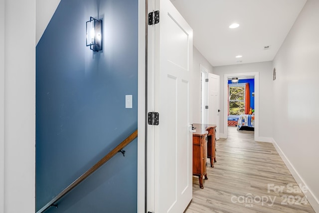 hallway with light wood-type flooring