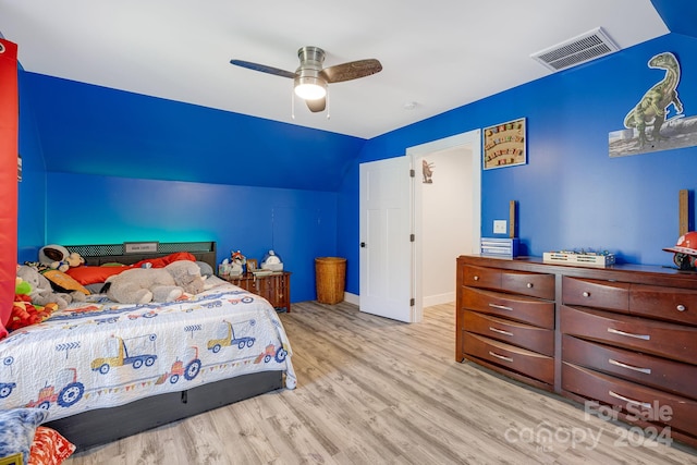 bedroom featuring ceiling fan, vaulted ceiling, and light hardwood / wood-style floors