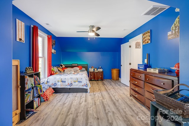 bedroom with light wood-type flooring and ceiling fan