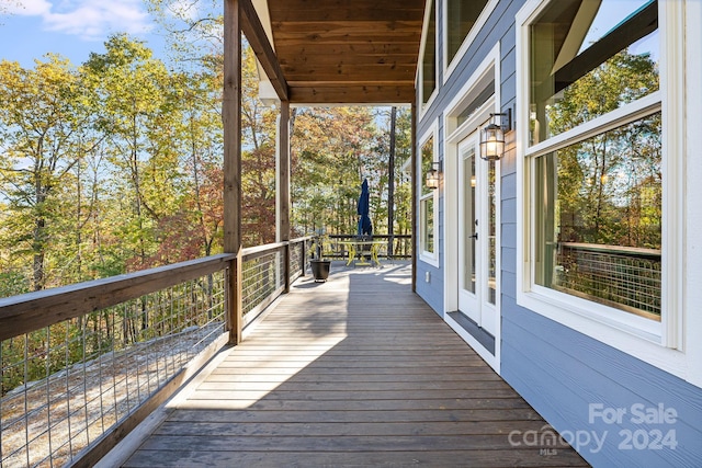 wooden deck featuring french doors