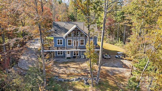 back of property featuring a deck