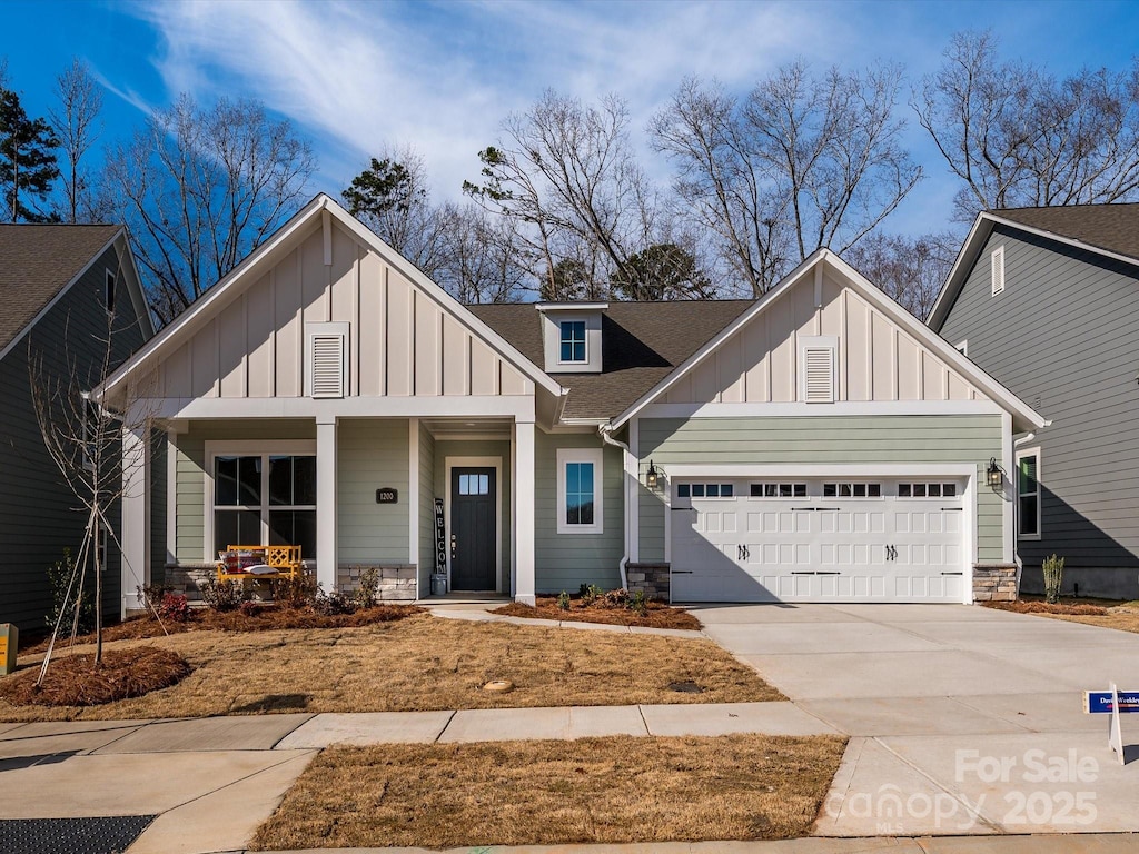 view of front of property with a garage and a porch