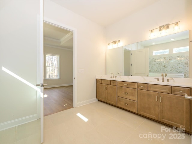 bathroom with crown molding, vanity, and walk in shower