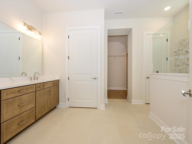 bathroom featuring tile patterned floors and vanity