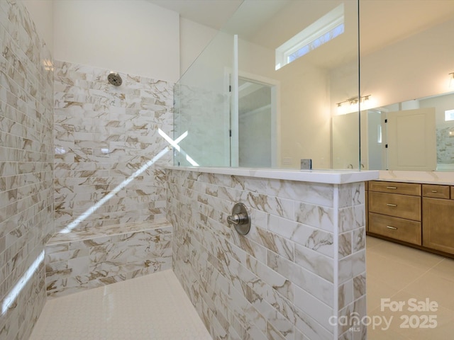 bathroom featuring tile patterned flooring and walk in shower