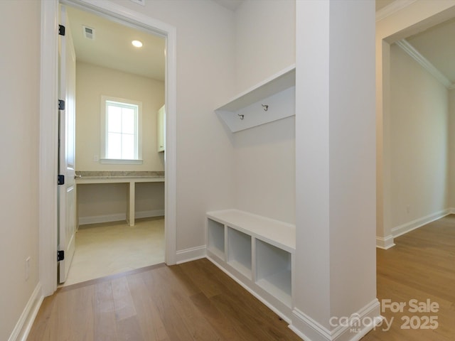 mudroom with hardwood / wood-style floors