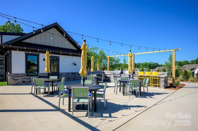 view of patio featuring a grill and exterior kitchen