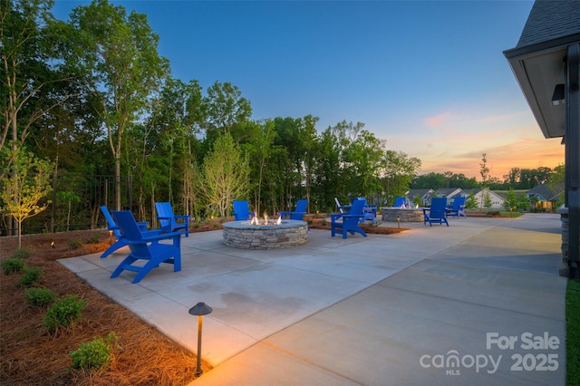 patio terrace at dusk with a fire pit