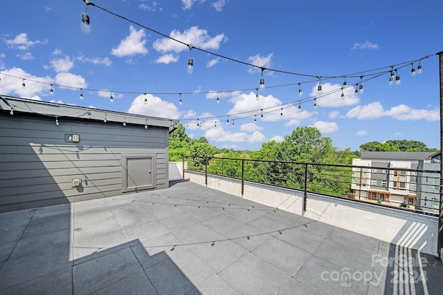 view of patio featuring a balcony