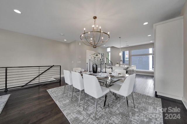 dining area with a chandelier and dark hardwood / wood-style floors