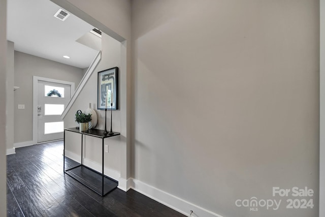 foyer with dark hardwood / wood-style flooring