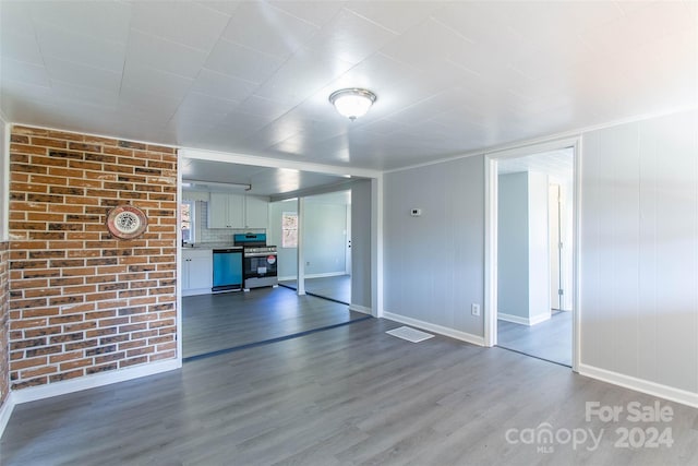 unfurnished living room with hardwood / wood-style flooring